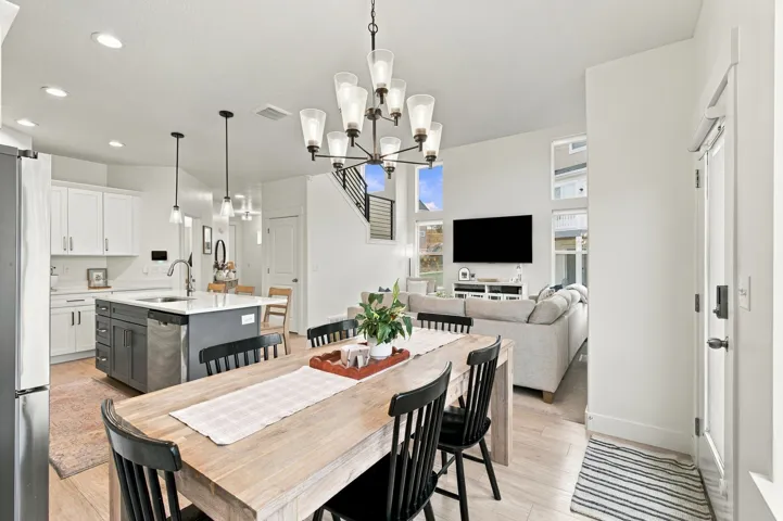 Kitchen with a central island, stainless steel appliances, and pendant lighting