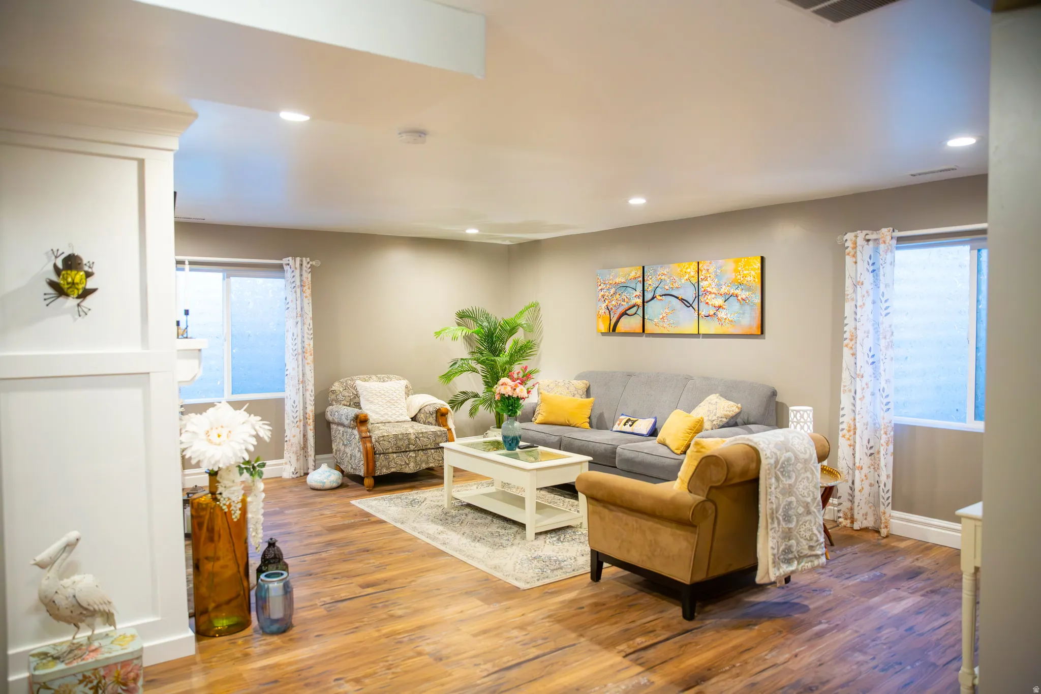Recessed lighting illuminating wood-finish flooring