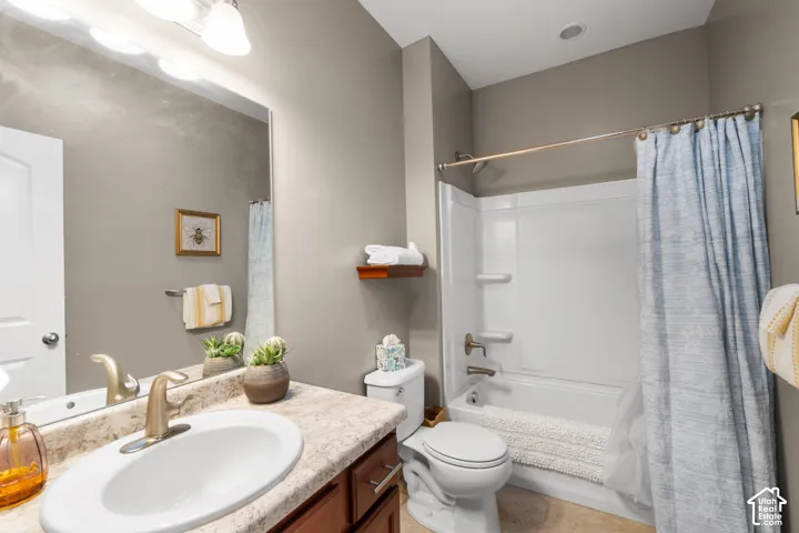 Vanity with integral sink, large mirror, and brushed brass faucet