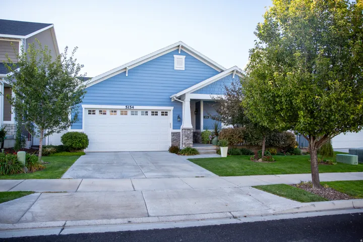 Blue horizontal siding with white trim