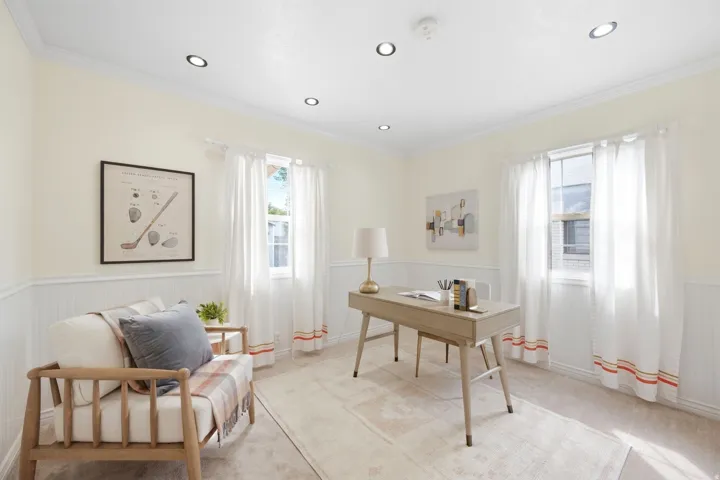 Recessed lighting, crown molding, double windows, wainscoting, and neutral wall tones