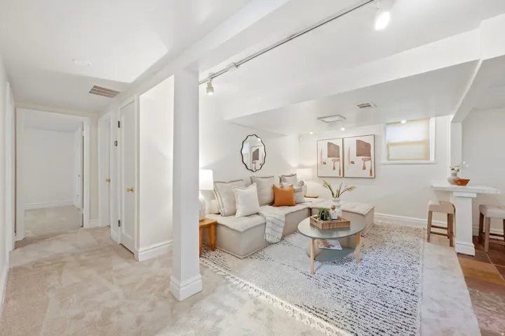 Recessed lighting and track lighting illuminate the living space