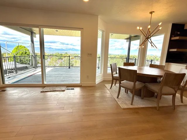 Expansive sliding glass doors open to an exterior deck