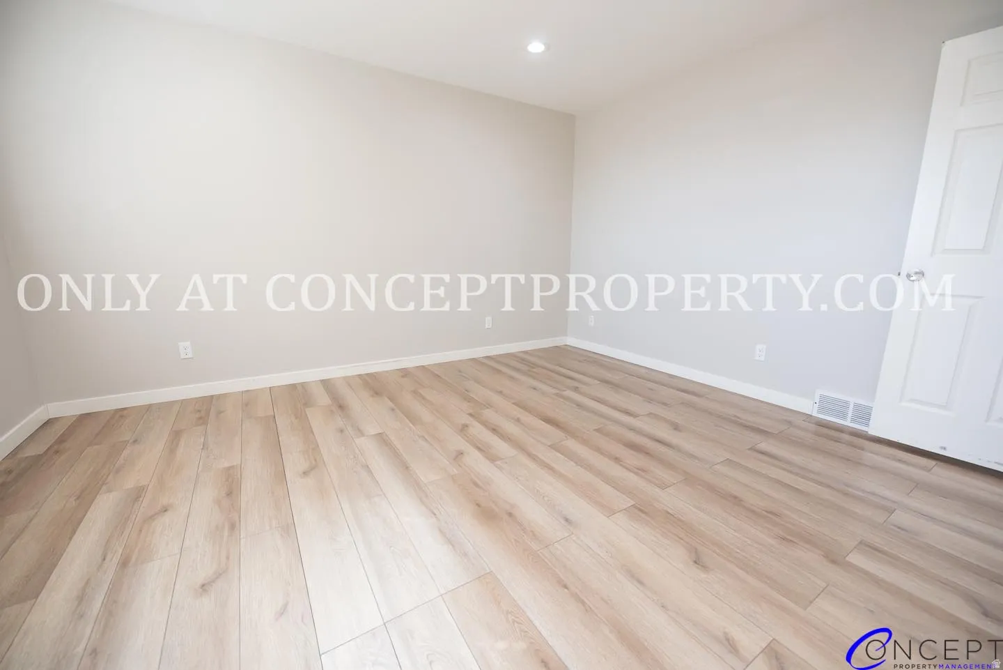 Wood-finish flooring with neutral wall tones and white trim