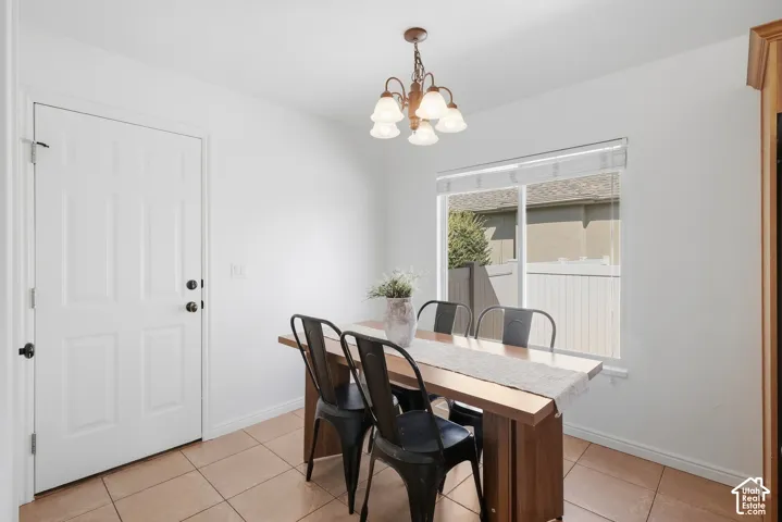 Recessed window, white trim, and a classic chandelier