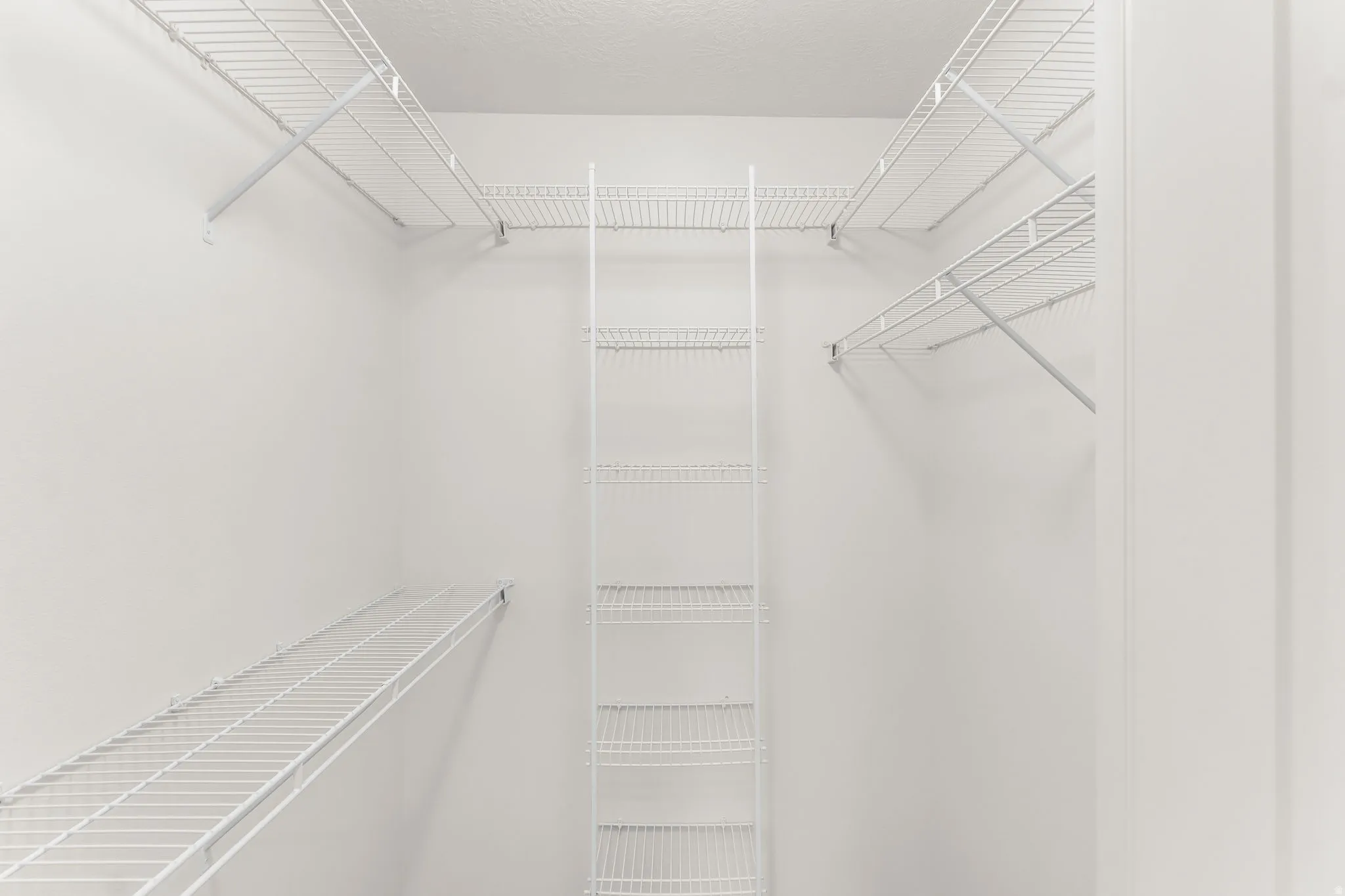 White wire shelving system providing ample storage
