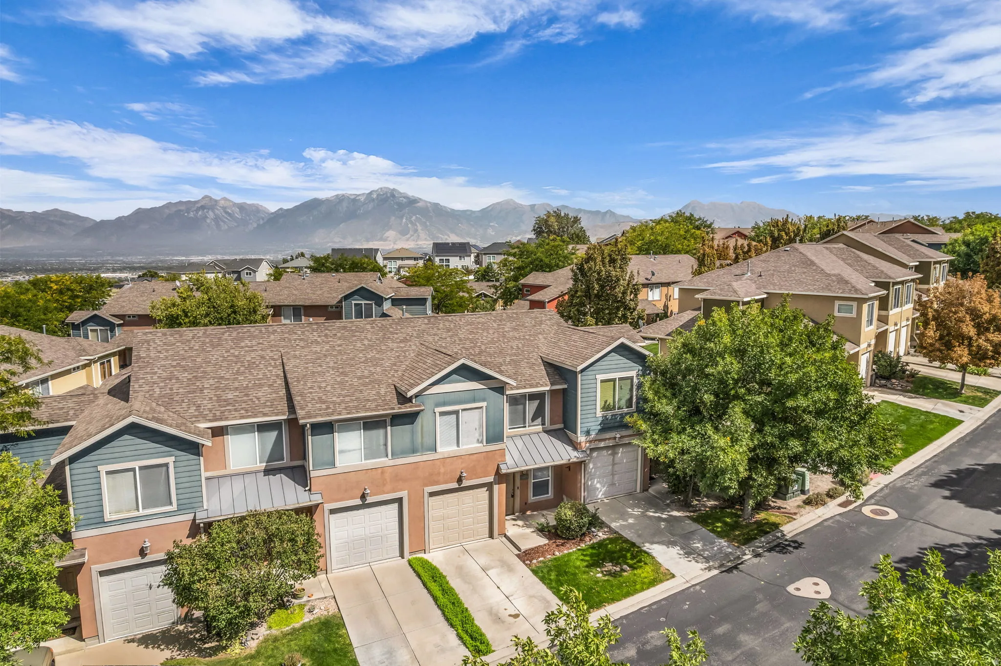 Contemporary townhome community with mountain backdrop