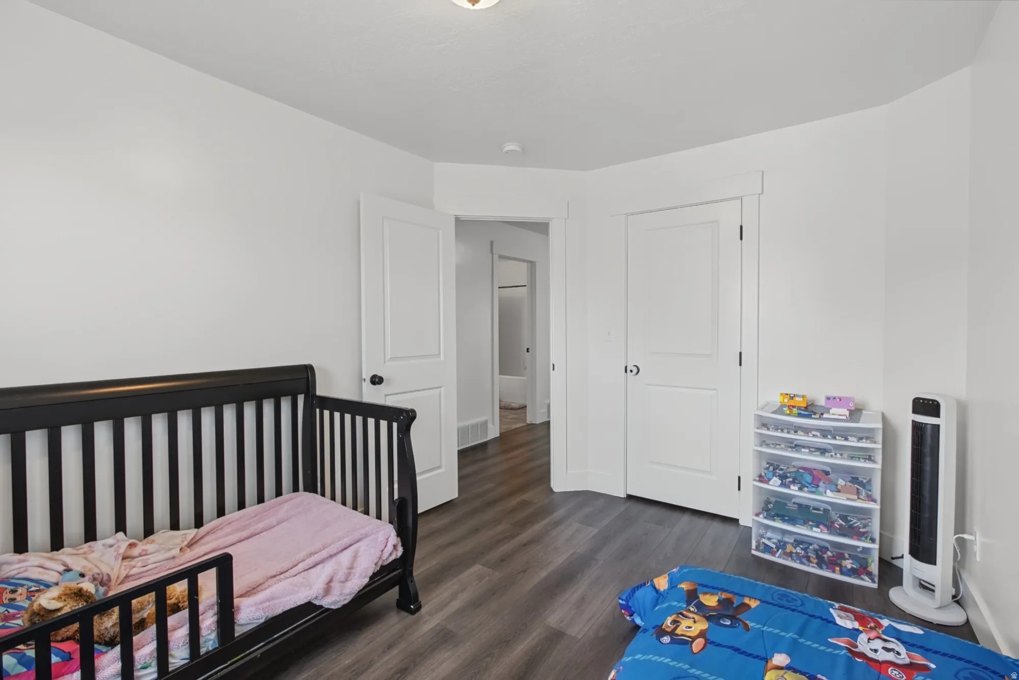 White painted walls and wood-finish flooring