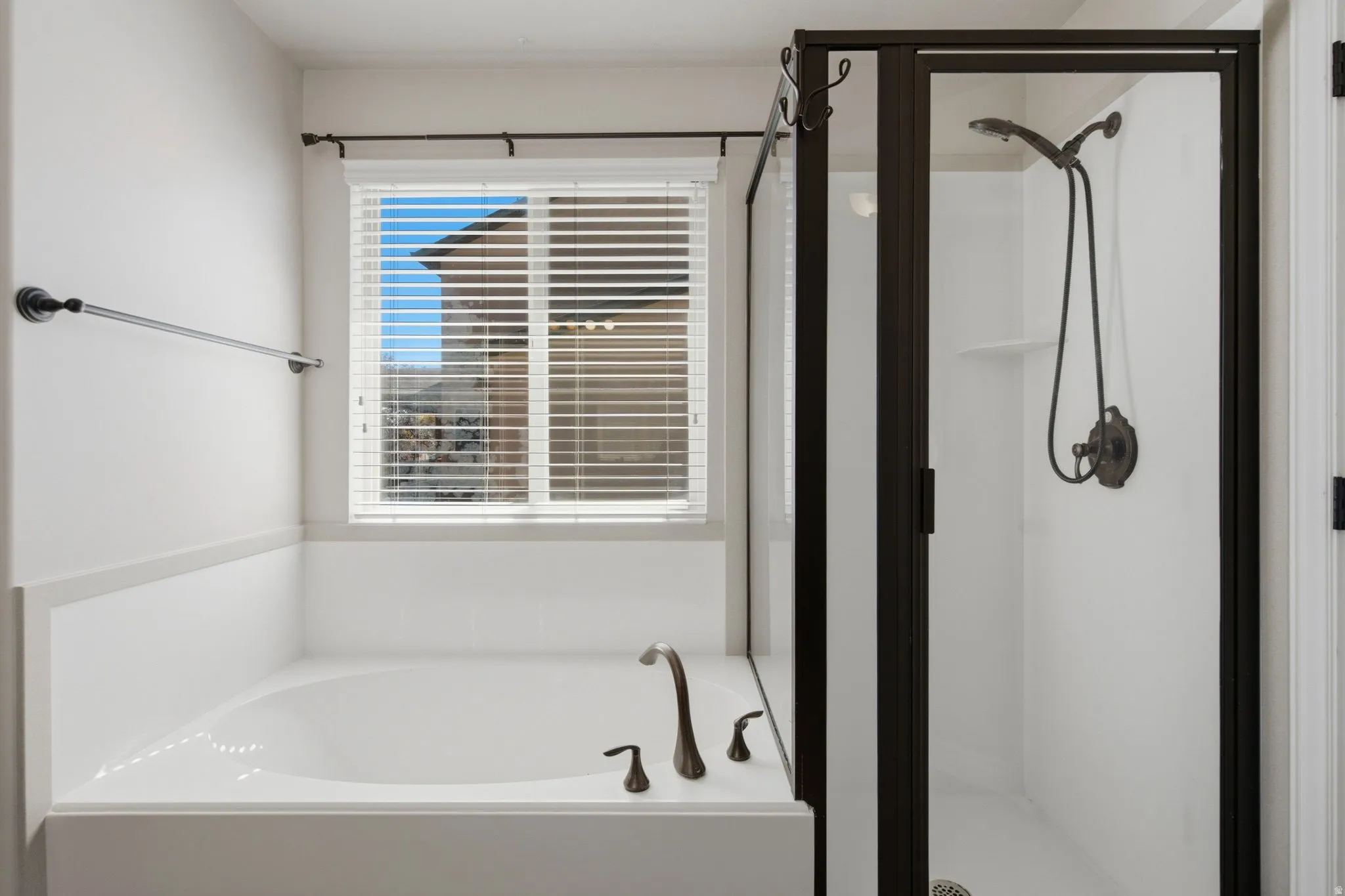 Built-in soaking tub with bronze-finish fixtures