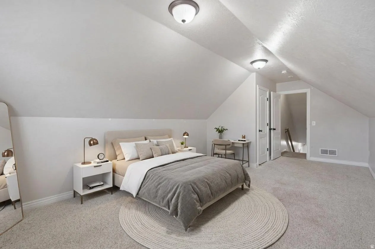 Angled ceiling lines and light gray carpeting
