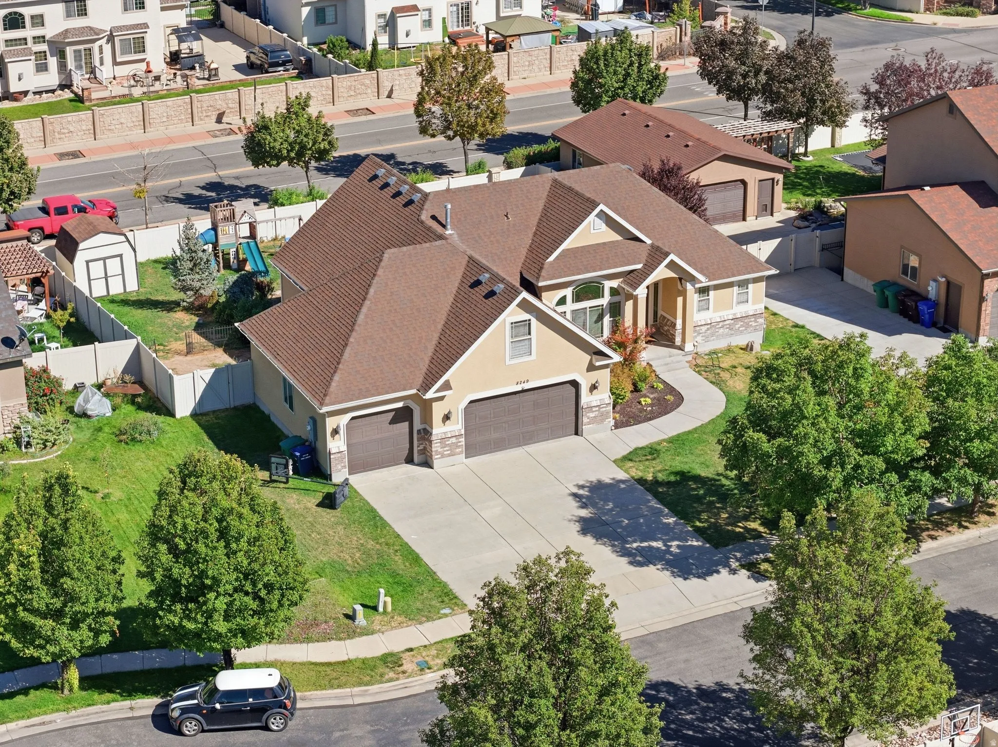 Single-family residence with a multi-gabled roof, attached two-car garage, and a concrete driveway