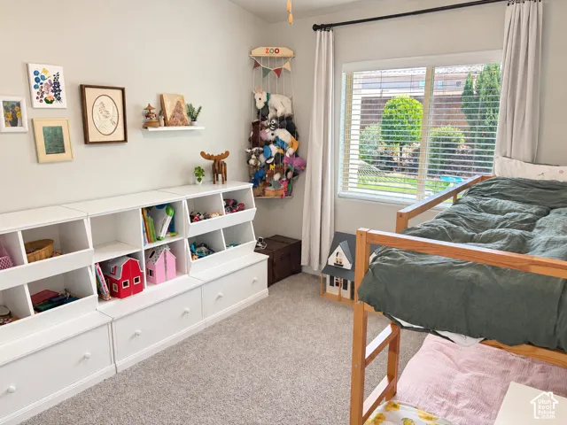 White built-in storage system with open bins and drawer storage