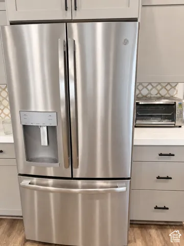 Stainless steel refrigerator with a French door design and bottom freezer drawer