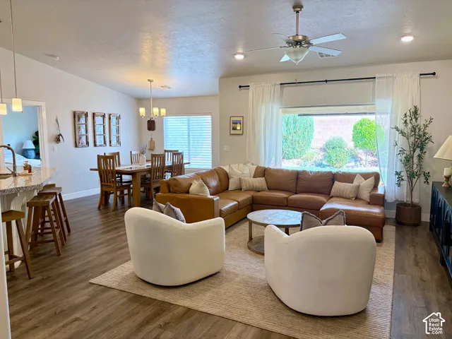 Open-concept living space featuring wood-finish flooring