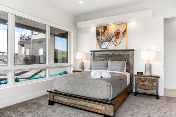 Expansive multi-pane windows, recessed lighting, and a neutral color palette