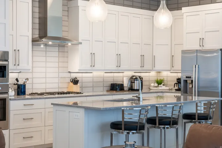 White shaker-style cabinetry with brushed nickel hardware