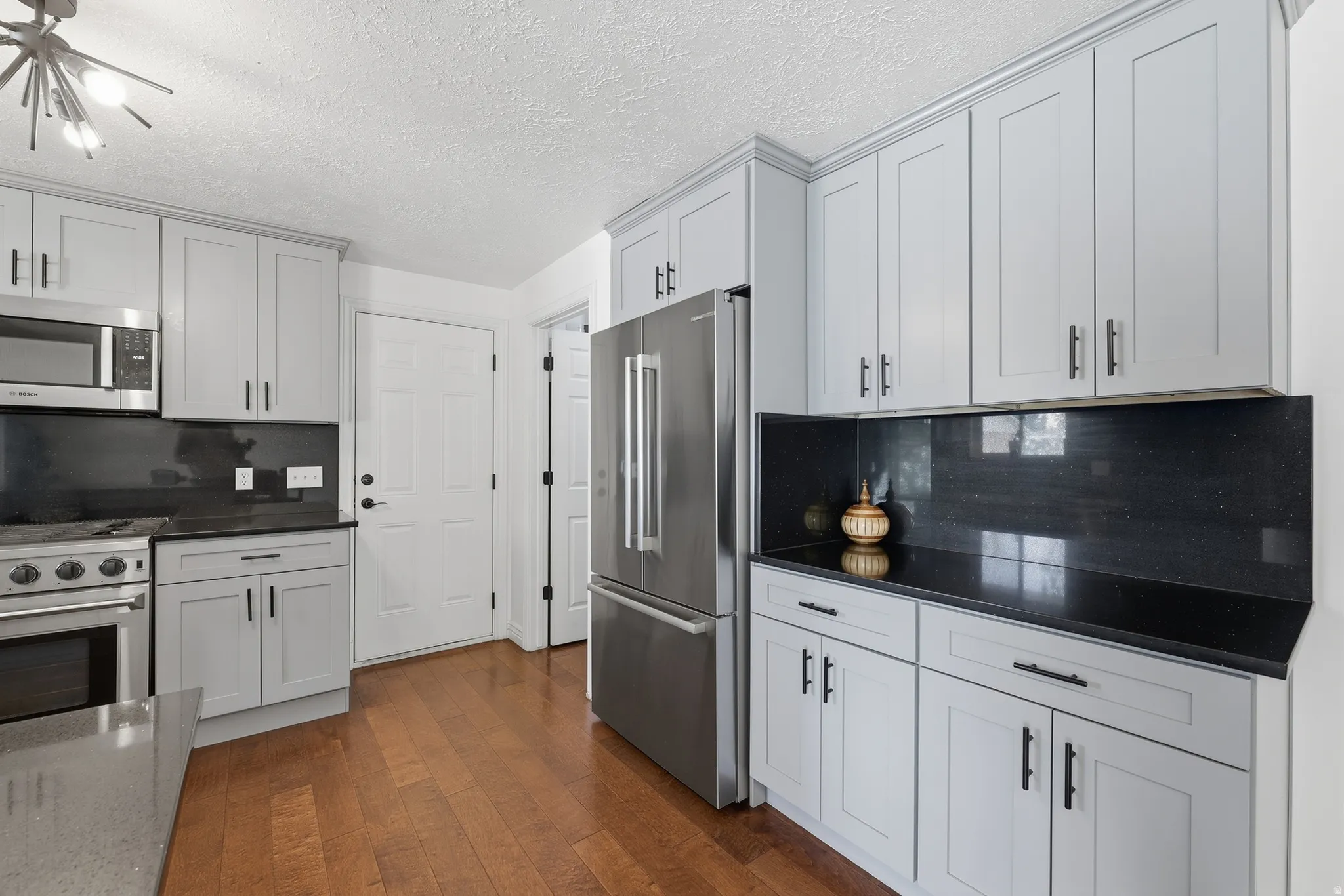 Light gray cabinetry with black hardware