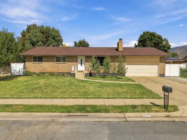 Brick exterior with a brown shingle roof