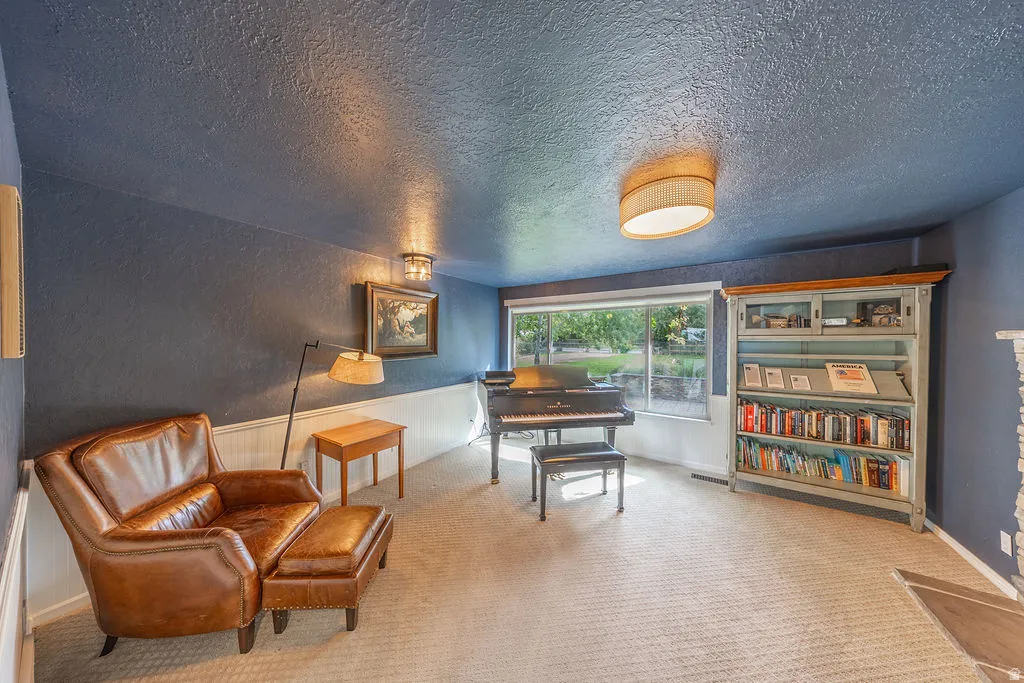 Recessed lighting and a flush-mount ceiling light illuminate the space