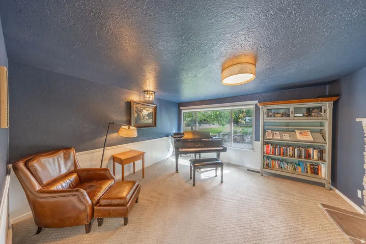 Recessed lighting and a flush-mount ceiling light illuminate the space