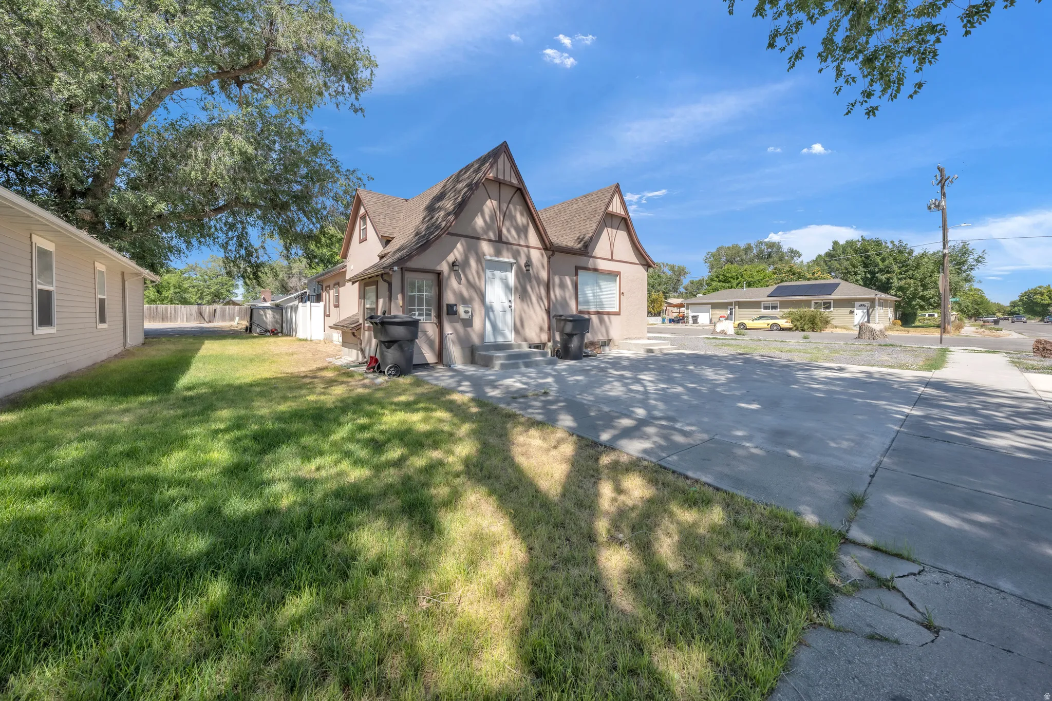 Tudor Revival style home with a gabled roofline and stucco exterior