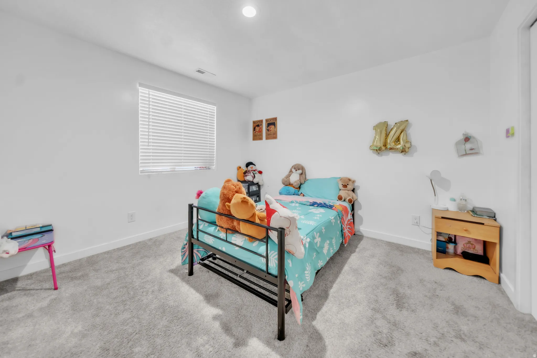 Recessed ceiling lighting, window with blinds, light-toned carpeting, and white walls