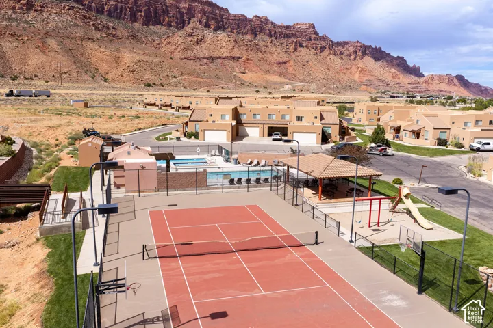 Community amenities featuring a tennis court, a swimming pool, and a playground