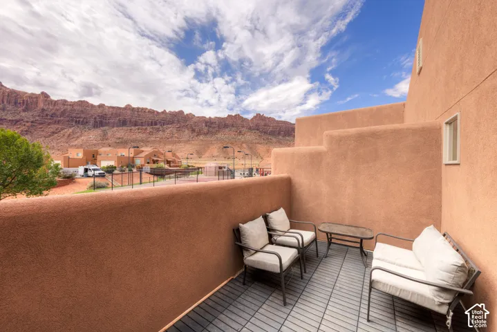 Terrace balcony with durable outdoor tile flooring and stucco exterior walls