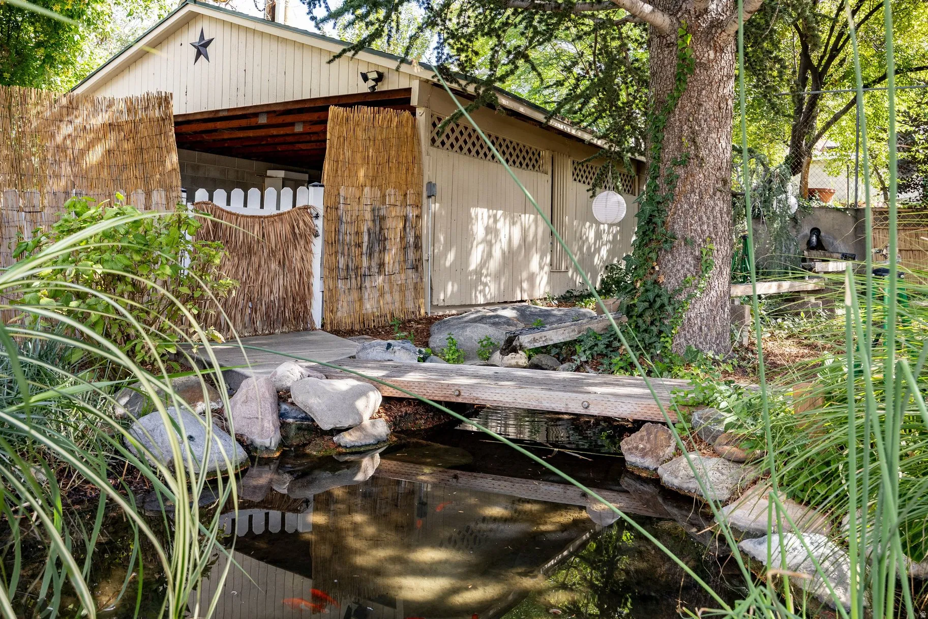 Water feature with a bridge and natural rock landscaping