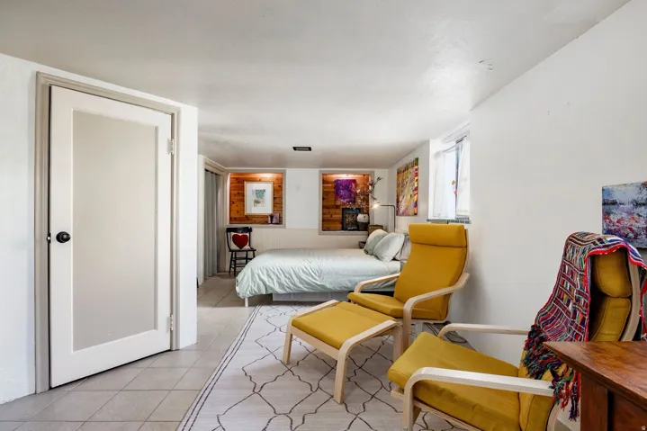 Tile flooring throughout with a partial area rug