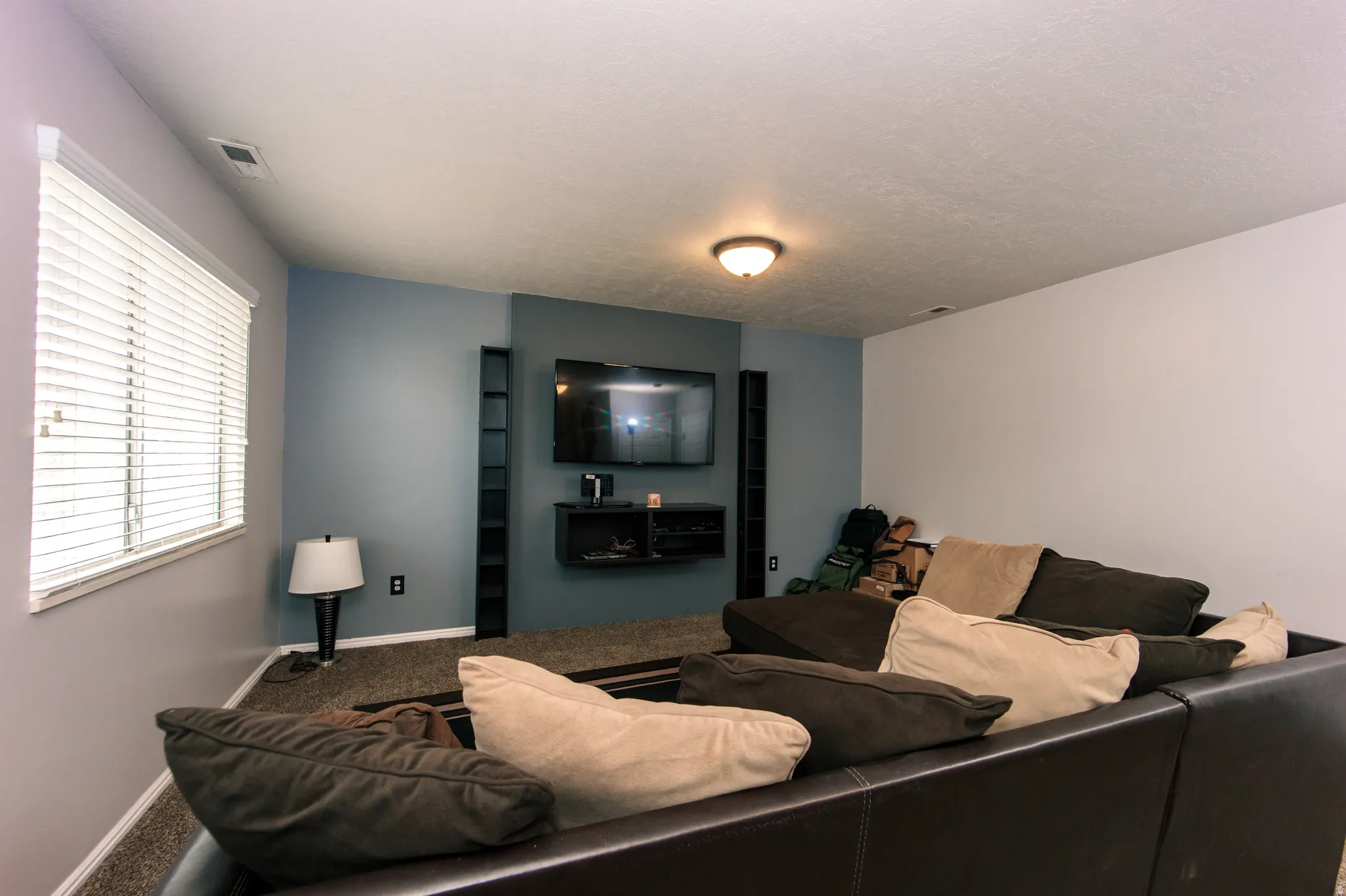 Neutral wall colors and a window with blinds