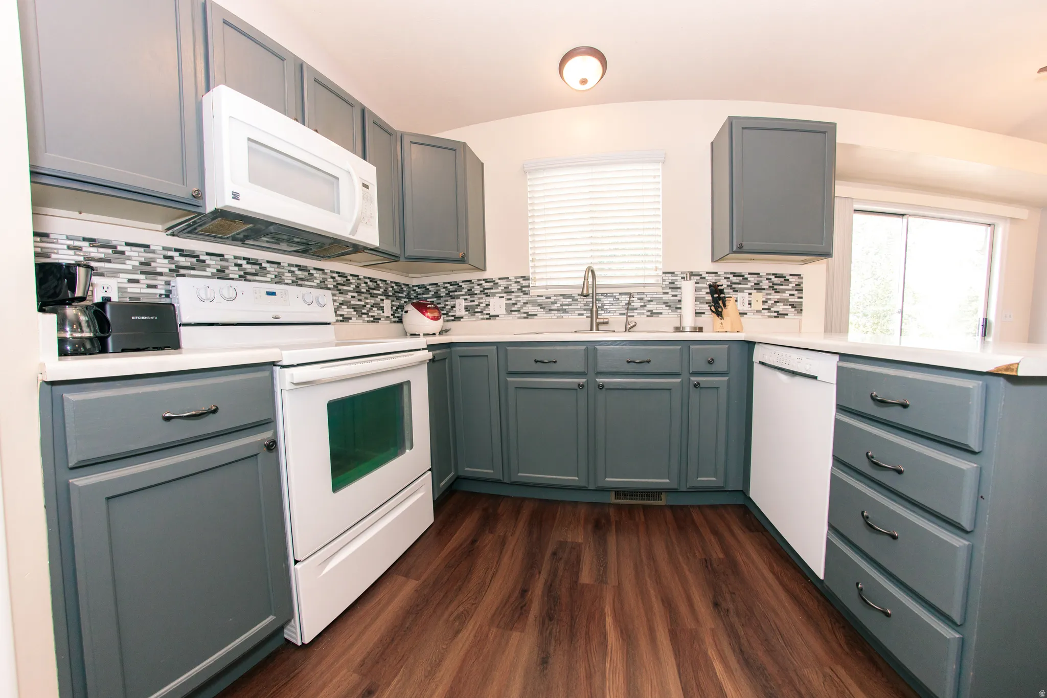 Wood-finish flooring with white countertops