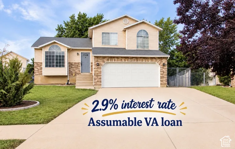 Two-story exterior with siding and stone accents, featuring a two-car garage, established front yard landscaping, and a paved driveway