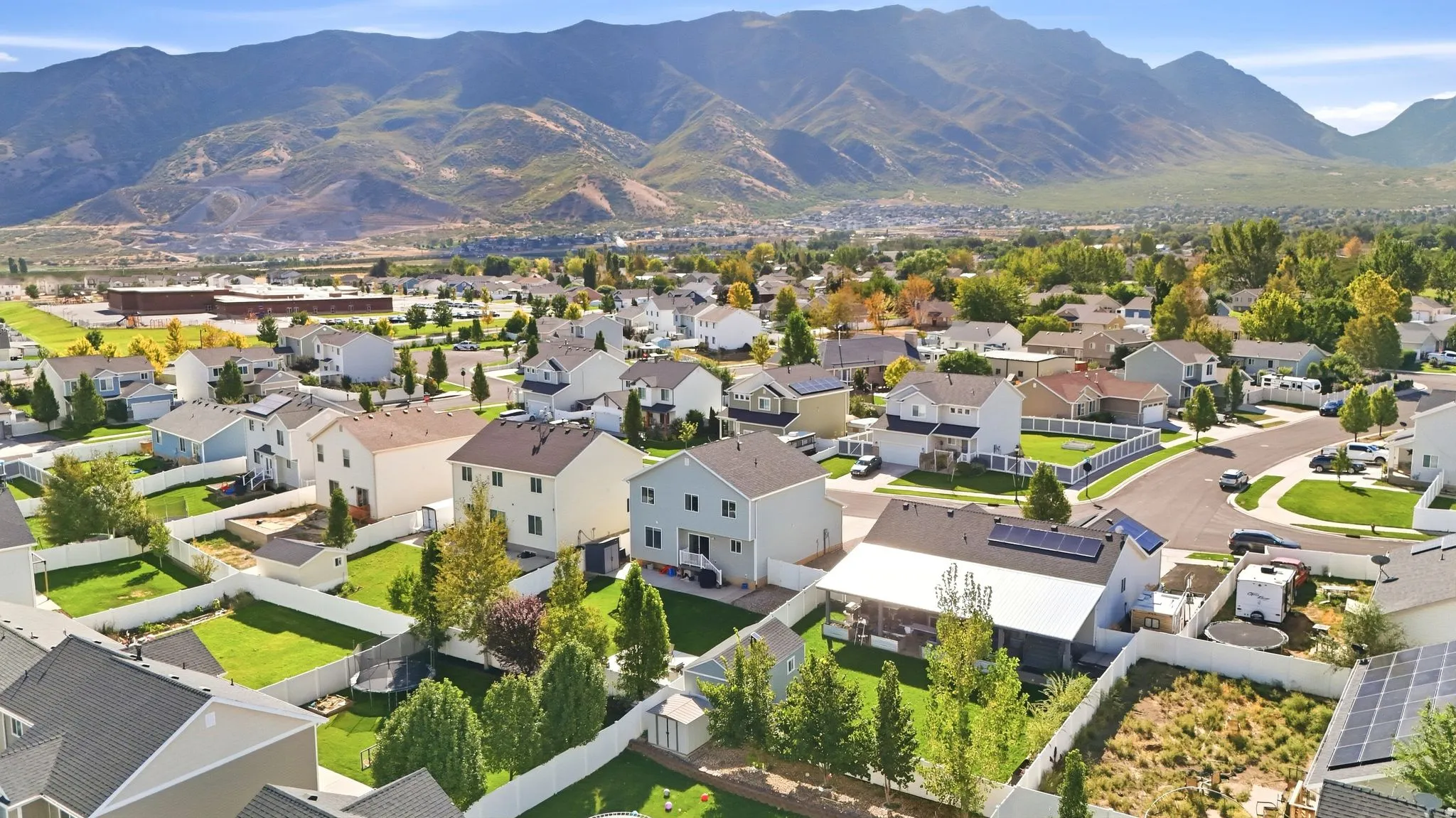 Neighborhood setting with mountain backdrop and established residential properties