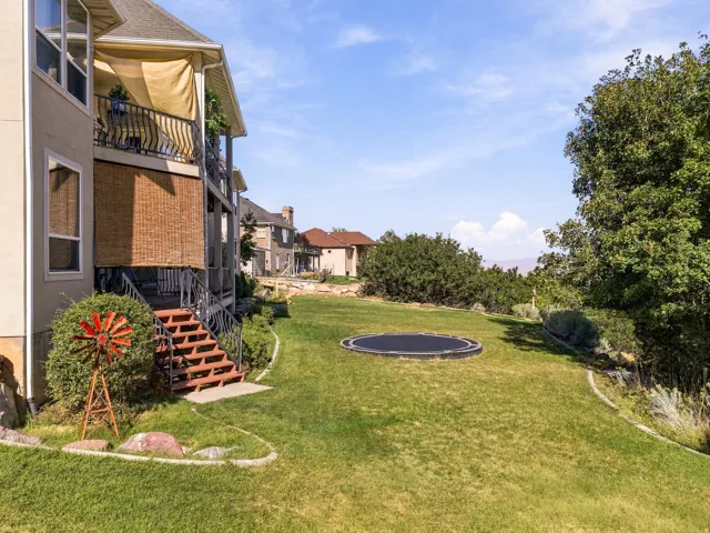 Expansive green lawn with established shrubbery