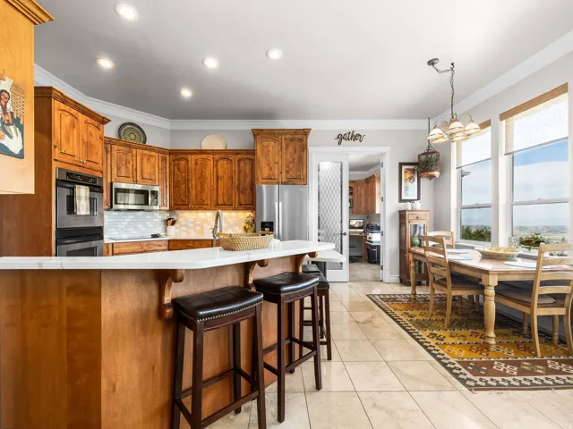 Kitchen featuring recessed lighting, a built-in oven, stainless steel appliances, and a tiled backsplash