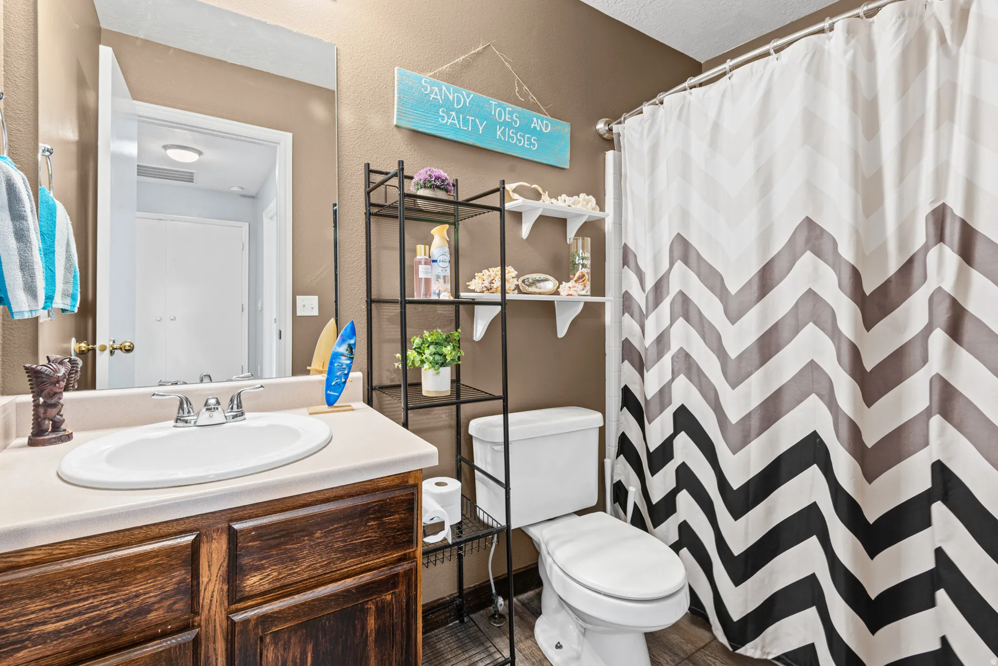 Built-in wood-finish vanity with an integrated sink and light-colored countertop