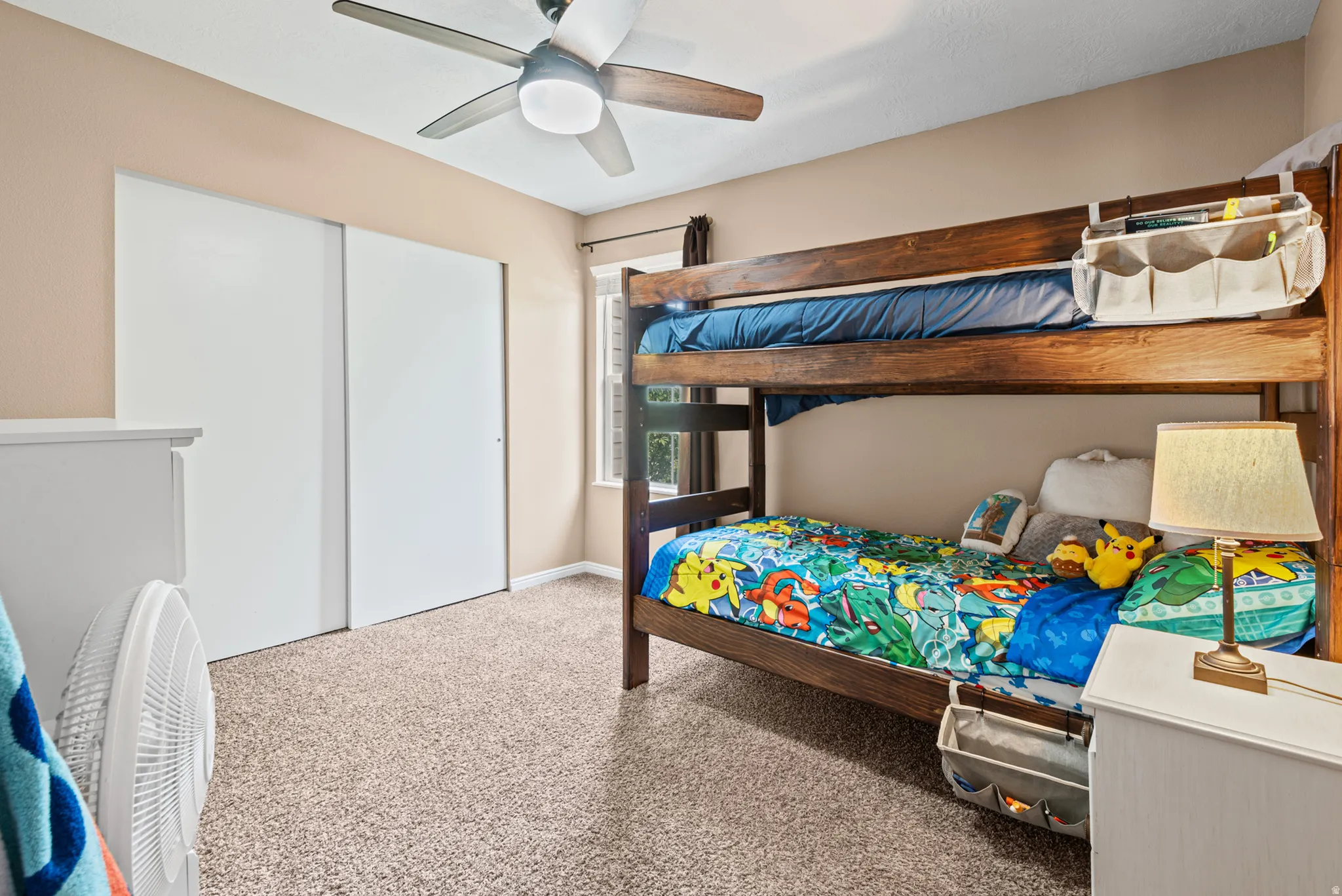 Neutral-toned walls complement plush carpet flooring