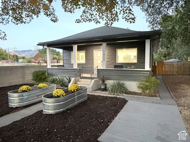 Covered porch with white support columns