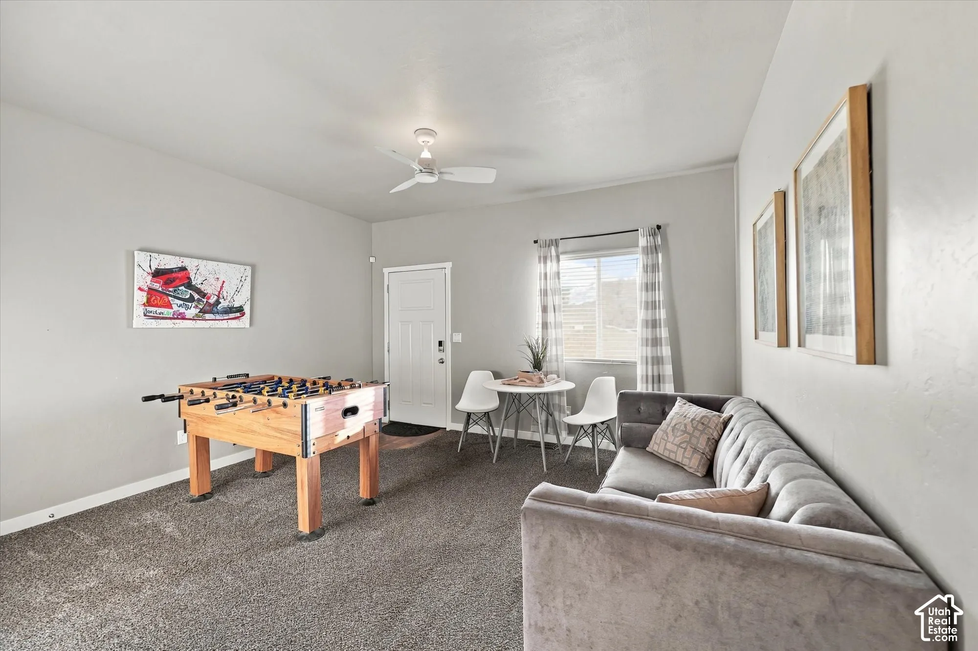 Recessed lighting, ceiling fan, carpet flooring, and a multi-pane window