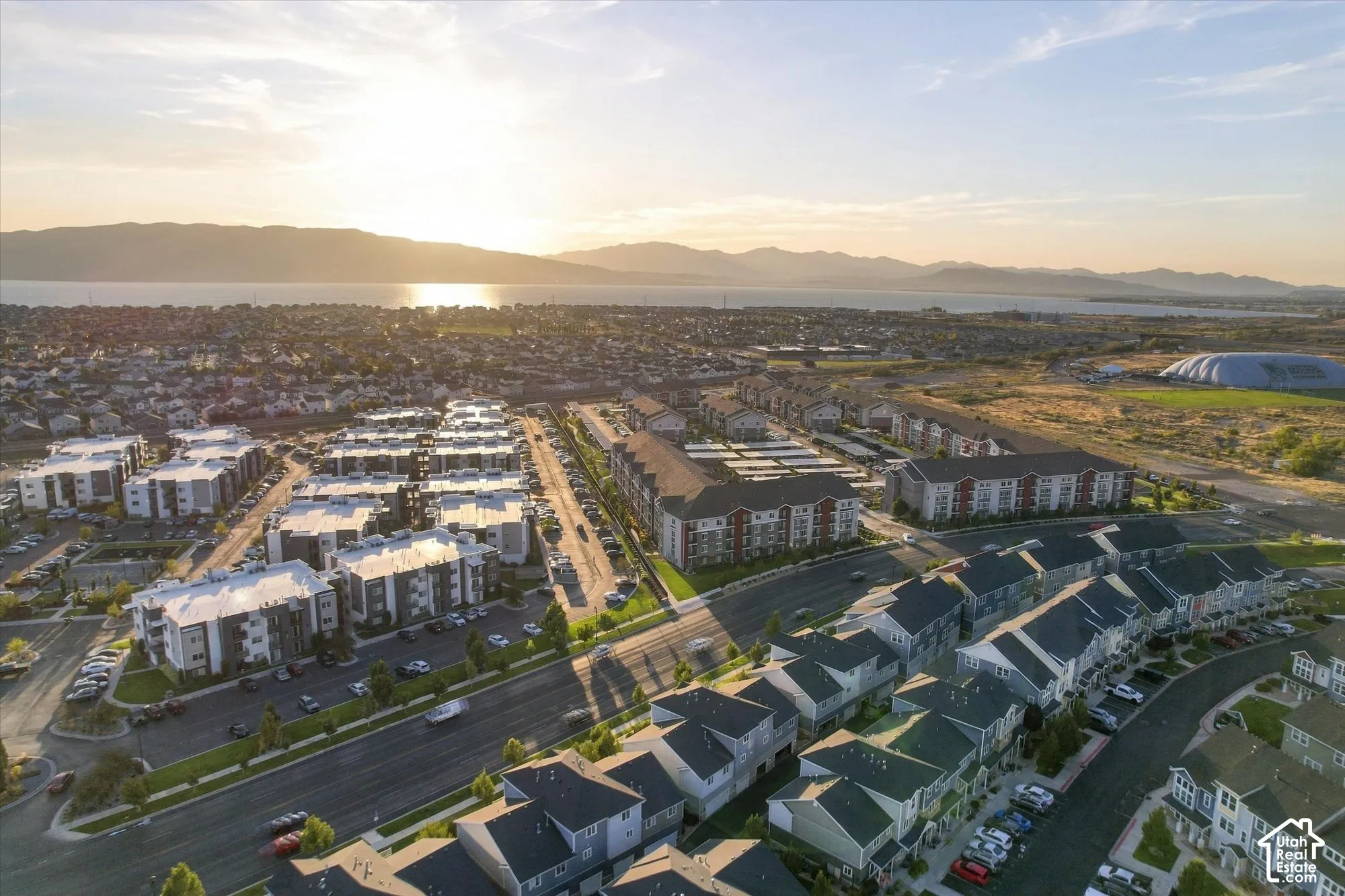 Expansive community with multi-story residential buildings and townhomes