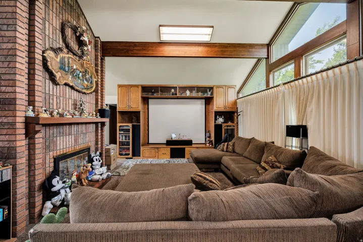 Brick fireplace with a wood mantel