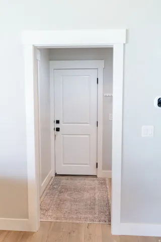 White paneled interior door with matte black hardware