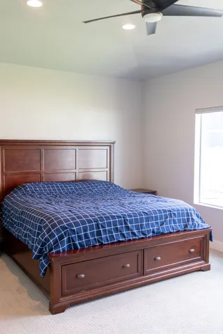 Recessed lighting, ceiling fan, and window offering natural light