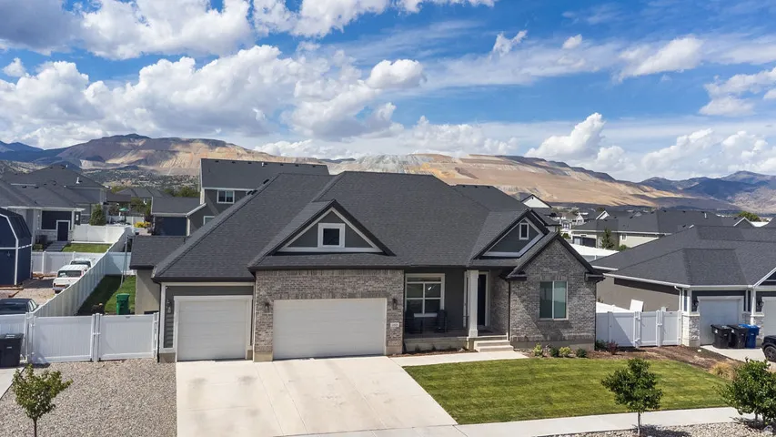 Stone and siding exterior with a two-car garage