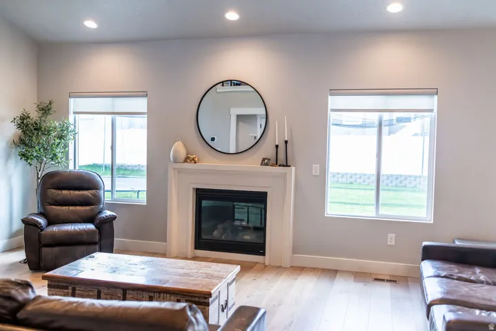 Light wood-finish flooring with a white trim