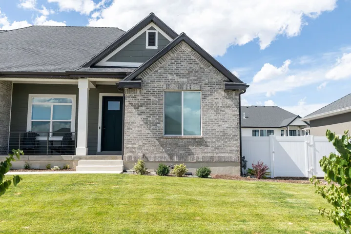 Gray brick facade with dark gray siding accents
