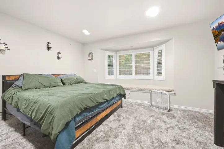 Bay window with louvered shutters and integrated window seat