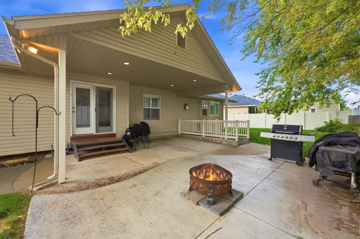 Covered patio with recessed lighting, concrete surface, and a railing-enclosed elevated area