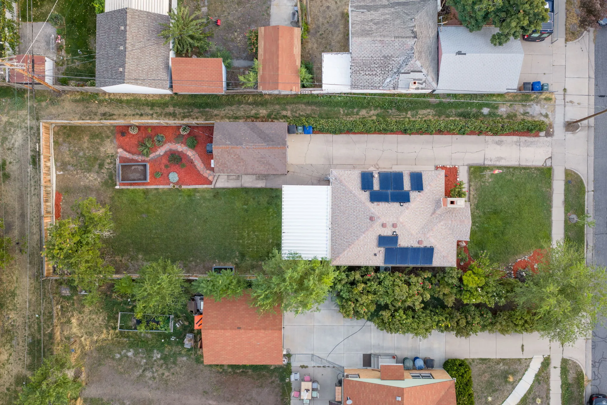 Single-story residence with a gabled roof and integrated solar panels